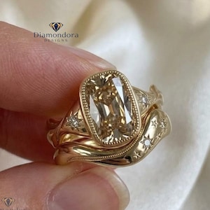 Conjunto de anillos de moissanita ovalada color champán, anillo de compromiso con engaste vintage, alianza de boda celestial de oro amarillo, anillo apilable nupcial único con detalles milgrain.