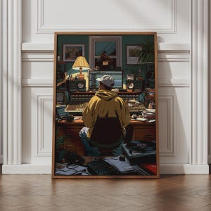 May include: A framed art print depicting a person in a yellow hoodie and white cap sitting at a desk in a music studio. The scene includes a computer monitor, audio mixing console, speakers, a desk lamp, and a turntable, all rendered in a detailed illustration style.