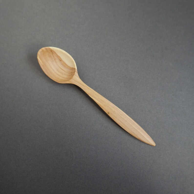 Wooden spoon hand carved of plum