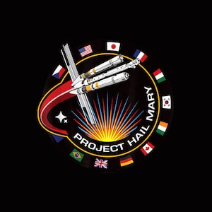 May include: A circular patch with the text "PROJECT HAIL MARY" and a stylized rocket design. The design includes a red arc, a star, and a burst of colorful rays. Flags of various nations surround the outer edge of the circle.