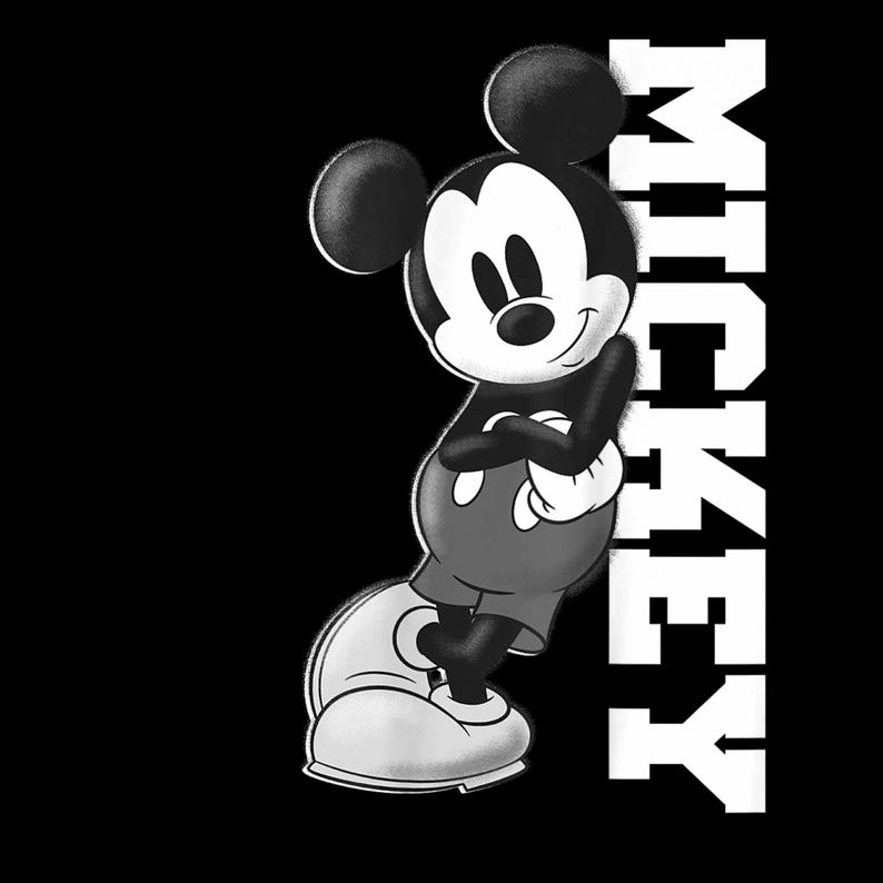 May include: A monochrome illustration of Mickey Mouse with crossed arms, wearing red shorts and white gloves. The word "MICKEY" is printed vertically in white block letters. The background is solid black.