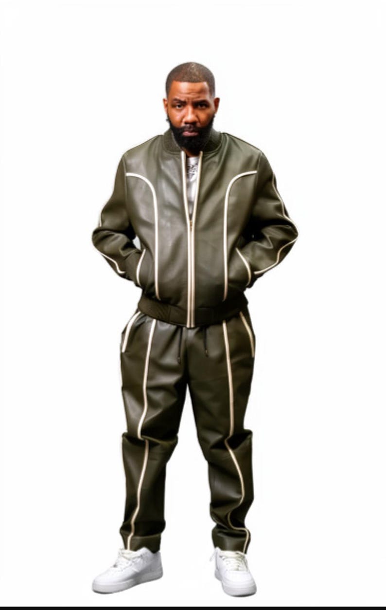 May include: Olive green leather bomber jacket and matching pants with white piping. The jacket has a zipper closure and the pants have a drawstring waist. The outfit is paired with white sneakers.