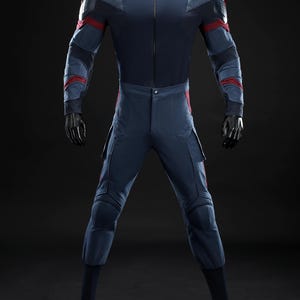 May include: A navy blue jumpsuit with red and grey accents, displayed on a mannequin. The suit features a zip-up front, padded shoulders, and cargo pockets. The sleeves and legs have red stripes and grey panels.
