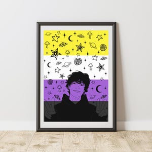May include: Framed art print featuring a person with a non-binary flag design. The flag is divided into yellow, white, and purple sections, adorned with stars, planets, mushrooms, and other whimsical illustrations. The person is making a peace sign.