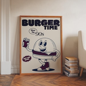 Könnte beinhalten: Gerahmtes Poster im Vintage-Stil mit einer Comic-Burger-Figur, die Pommes hält. Der Text "BURGER TIME" und "Since the 90s" ist zu sehen, sowie der Satz "JUST ONE MORE". Das Kunstwerk hat eine Retro-Ästhetik.