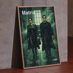 Peut inclure: Affiche encadrée du film "Matrix" avec Keanu Reeves et Carrie-Anne Moss. L'affiche présente un schéma de couleurs vert et noir avec le titre "Matrix" en haut. L'année 1999 est affichée en bas à droite.