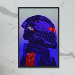 May include: A framed art print featuring a stylized image of a futuristic helmet in shades of blue and red. The helmet has the letters "N7" on the side. The artwork is set against a textured, light gray background.