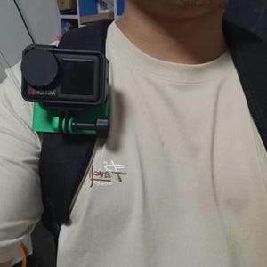 May include: A white ceramic mug with a black handle and the text "But First, Coffee" in a bold, black font. The mug is set against a neutral background, highlighting its simple design.