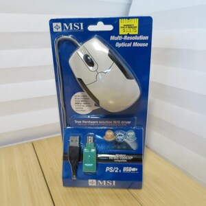 May include: A white and black MSI multi-resolution optical mouse in its original packaging. The packaging is blue with the text "Multi-Resolution Optical Mouse". The mouse has a USB and PS/2 connection.