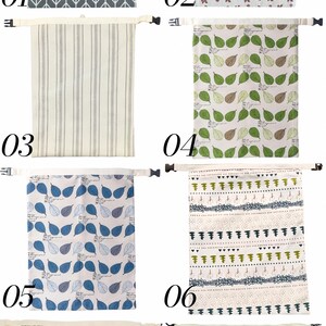 May include: A collection of eight rectangular fabric bags, each featuring a top strap with a black plastic buckle. The designs include gray herringbone, floral patterns, vertical stripes, green and blue leaf prints, and geometric motifs.