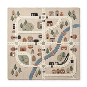 May include: A square beige rug featuring a tufted city map design with white roads, roundabouts, and crosswalks. The scene includes small houses, green trees, a winding blue river with bridges, and black train tracks. The text Srivas Rugs is visible.