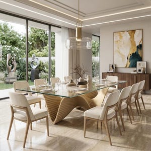 May include: A modern dining room set with a glass-top table and eight cream-colored chairs. The table has a unique, sculptural wooden base. A gold pendant light hangs above the table. The room features large windows and a neutral color palette.