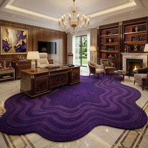 May include: A luxurious home office featuring a large, dark wood desk with gold trim, a white leather chair, and a vibrant purple, wave-patterned rug. The room includes a fireplace, bookshelves, and a crystal chandelier.