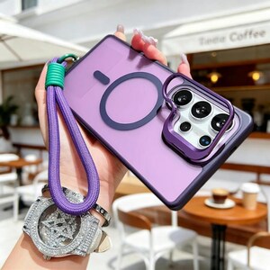 May include: A purple phone case with a matching camera lens protector and a purple lanyard. The case has a dark purple ring and a green and purple wrist strap. The phone case is held in a hand.