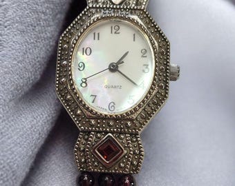 VTG 90s Avon Watch Stainless Steel and Garnet Mother Of Pearl Face New Battery