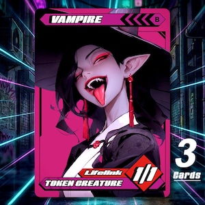 May include: A white ceramic mug with a black handle and the text "But First, Coffee" in a bold, black font. The mug is set against a blurred background. The mug appears to be approximately 10 cm tall.