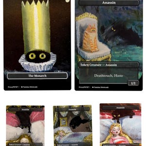 May include: Five rectangular trading cards featuring artistic illustrations. One card shows a tall yellow crown over two yellow eyes. Four cards depict an orange or black cat as an Assassin, with text including Token Creature, Deathtouch, and Haste.