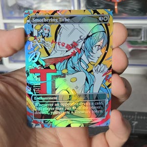 May include: A holographic Smothering Tithe trading card featuring an anime-style illustration of a figure with blue hair in a white hood. The card text reads: Whenever an opponent draws a card, that player may pay 2. If the player doesn't, you create a Treasure token.