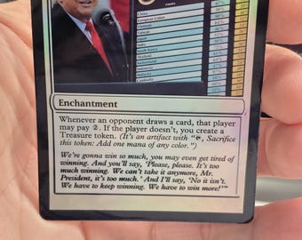 May include: A collectible card titled "Smothering Tariffs" featuring an image of a person speaking at a podium. The card includes text about tariffs and a quote. The card is held in a hand.