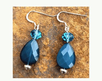 Blue teardrop faceted acrylic earring with Czech glass bead accent.