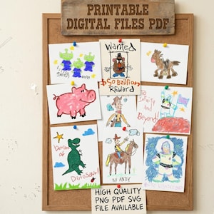 May include: A corkboard displays colorful children's drawings of cartoon characters, including aliens, a pig, a horse, a cowboy, and an astronaut. The board has a wooden sign that reads "PRINTABLE DIGITAL FILES PDF" and a smaller sign that says "HIGH QUALITY PNG PDF SVG FILE AVAILABLE".