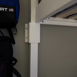 May include: A set of three ceramic mugs with a speckled, matte finish. The mugs are in shades of gray, white, and black. Each mug has a simple, modern design, perfect for coffee or tea.