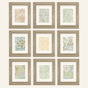 May include: Nine framed prints with floral patterns in various colors, including pink, green, blue, and yellow. The frames are a light wood color.