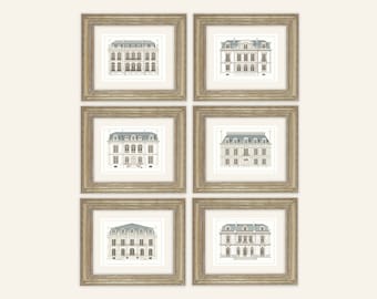 May include: Set of six framed prints featuring illustrations of classic Parisian buildings with gray roofs and white facades. The frames are a light gold color.
