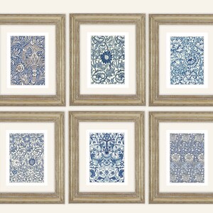 May include: Six framed art prints featuring intricate blue and white floral patterns. The prints are displayed in gold-colored frames with white matting. The artwork showcases a variety of detailed botanical designs, creating a cohesive set for home decor.