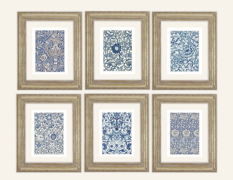 May include: Six framed art prints featuring intricate blue and white floral patterns. The prints are displayed in gold-colored frames with white matting. The artwork showcases a variety of detailed botanical designs, creating a cohesive set for home decor.