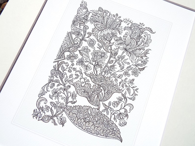 May include: Black and white floral print art framed in a white mat. The detailed illustration features a variety of flowers, leaves, and ornate scrollwork. The artwork is a detailed pen and ink drawing.