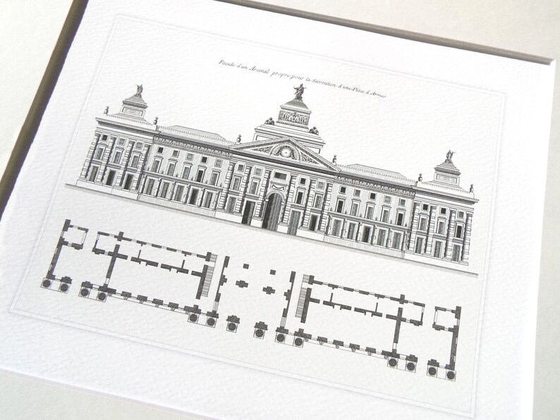 May include: Black and white architectural print of a building with a detailed facade and a floor plan below. The print is framed and features text in French.