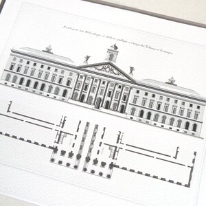 May include: Black and white architectural print of a building with a detailed facade and a floor plan below. The print includes text in French. The building features columns, arched windows, and a central tower.