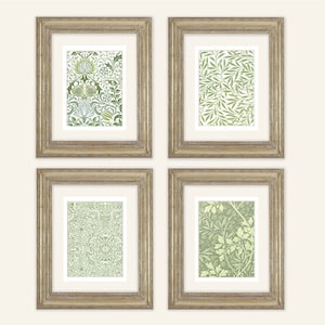 May include: Set of four framed prints with green and white floral patterns. The frames are a light wood color with a distressed finish.