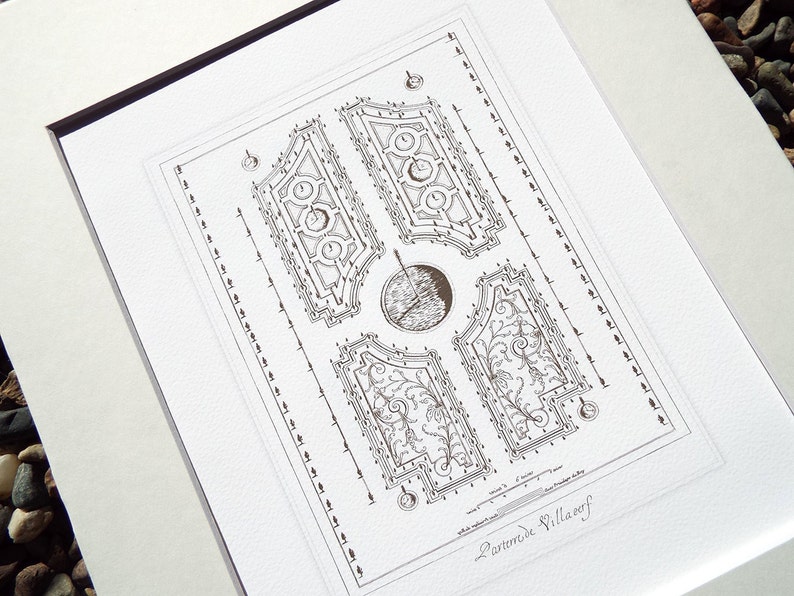 May include: A black and white line drawing of a garden plan, labelled "Parterre Villaref." The plan features a symmetrical design with four sections, each containing a unique pattern of flowers and foliage.