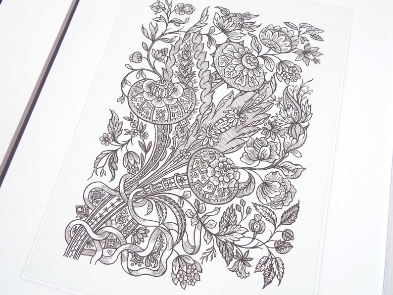 May include: Detailed black and white floral illustration featuring stylized flowers, leaves, and ribbons. The artwork is framed and presented on a white background, showcasing intricate patterns and textures. The design is reminiscent of vintage botanical prints.