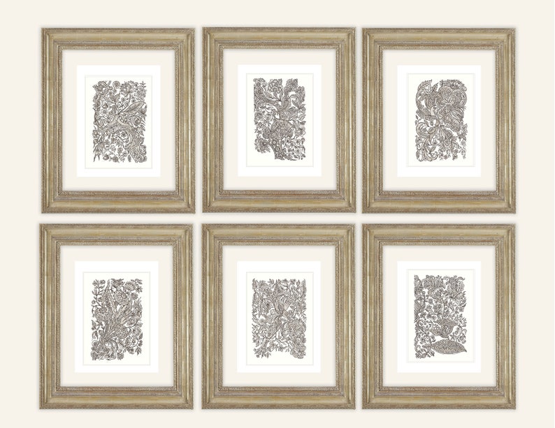 May include: Six framed art prints with intricate black and white floral and botanical designs. The prints are displayed in gold-colored frames with white matting. The artwork features detailed patterns of leaves, flowers, and other natural elements.