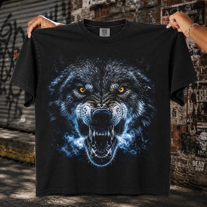 Ferocious wolf with glowing amber eyes, exposed fangs, and electric blue energy mist emerging from its mouth on black background, powerful halftone predator design for t-shirt sublimation print