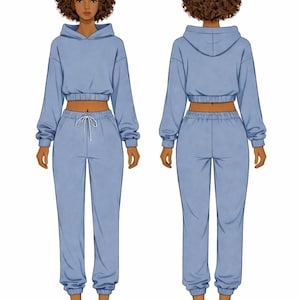 May include: A light blue cropped hoodie and matching sweatpants set. The hoodie has long sleeves and a drawstring hood. The sweatpants have a drawstring waist and cuffed ankles. The outfit is shown on a person from the front and back.