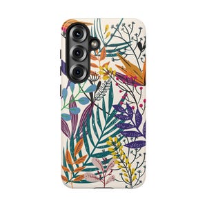 May include: A rectangular smartphone case with a cream-colored background featuring a dense botanical pattern of stylized leaves and branches in shades of orange, teal, purple, yellow, and pink, with a triple-lens camera cutout at the top left.