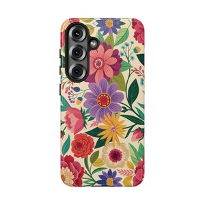 May include: A floral phone case featuring a vibrant pattern of colorful flowers and green leaves against a cream background. The design includes pink, purple, yellow, and red blooms, creating a lively and artistic look.