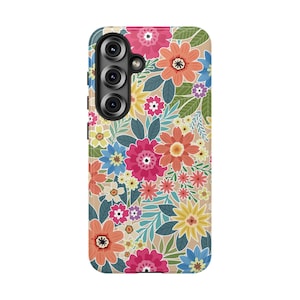 May include: A phone case with a floral pattern. The case features a beige background covered in colorful flowers in shades of pink, orange, yellow, and blue, with green leaves. The phone case has a camera module on the upper left.