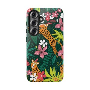 May include: A smartphone case featuring a dark green background with a repeating pattern of orange leopards with spots, pink and white flowers, and green tropical leaves. The leopards are depicted with small feathers on their heads.