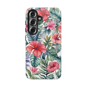 May include: A white phone case featuring a vibrant watercolor floral design. The pattern includes large red hibiscus flowers, pink blossoms, and lush green tropical leaves. The case has a camera module with three lenses.