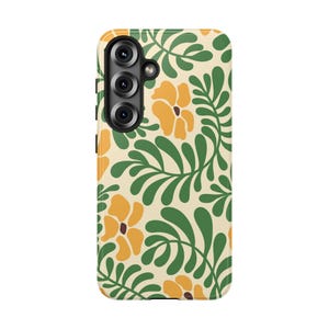 May include: A rectangular smartphone case featuring a cream-colored background with a repeating pattern of stylized yellow flowers and dark green leafy branches. The case includes a black camera module cutout positioned on the upper left side.