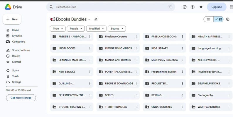 May include: Screenshot of a Google Drive interface displaying a folder titled "Ebooks Bundles." The folder contains subfolders categorized by topic, including "Freebies," "Ikigai Books," and "Learning Material."
