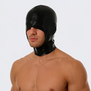 May include: A black hood made of a shiny material, covering the head and neck. The hood has an opening for the face and is worn by a person. The material appears to be smooth and form-fitting.