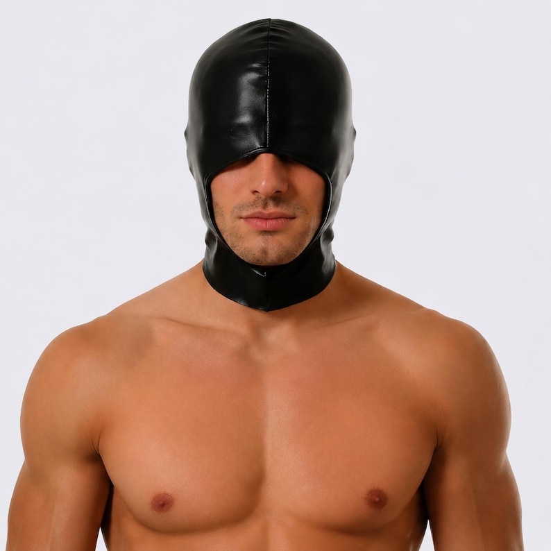 May include: A black hood made of a shiny material, covering the head and neck. The hood has an opening for the face and is worn by a person. The background is plain white.