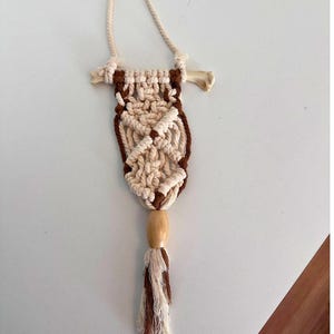 May include: A set of three ceramic mugs with a speckled, matte finish. The mugs are in shades of cream, light gray, and dark gray. Each mug has a simple, minimalist design, perfect for coffee or tea.