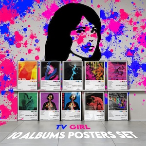 May include: A set of ten album posters by TV Girl, each with unique artwork and titles. The posters are displayed against a backdrop of a woman's face and colorful paint splatters in pink and blue. The set is labeled "TV GIRL 10 ALBUMS POSTERS SET."